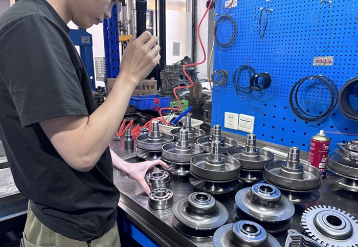 Technician inspecting CVT pulley components