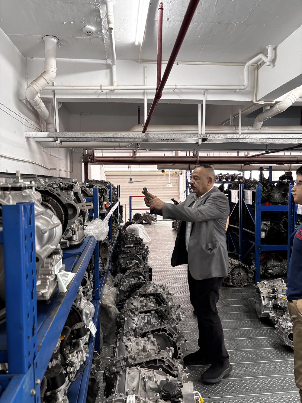 Customer photographing transmission stock in the Meishun warehouse